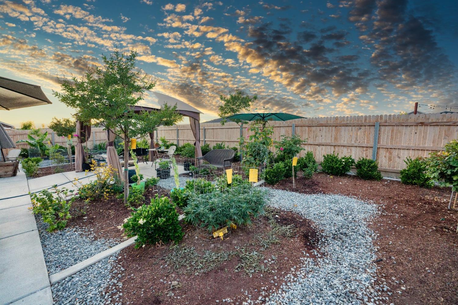 1818 Softwind Drive Tulare, CA 93274 - Photo 46 of 46 a view of a garden with pathway