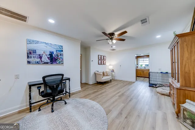 a view of a workspace with furniture and a workspace