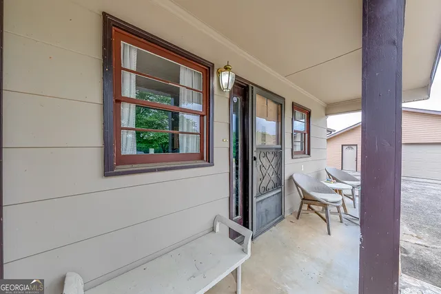 a room with a window and a chair