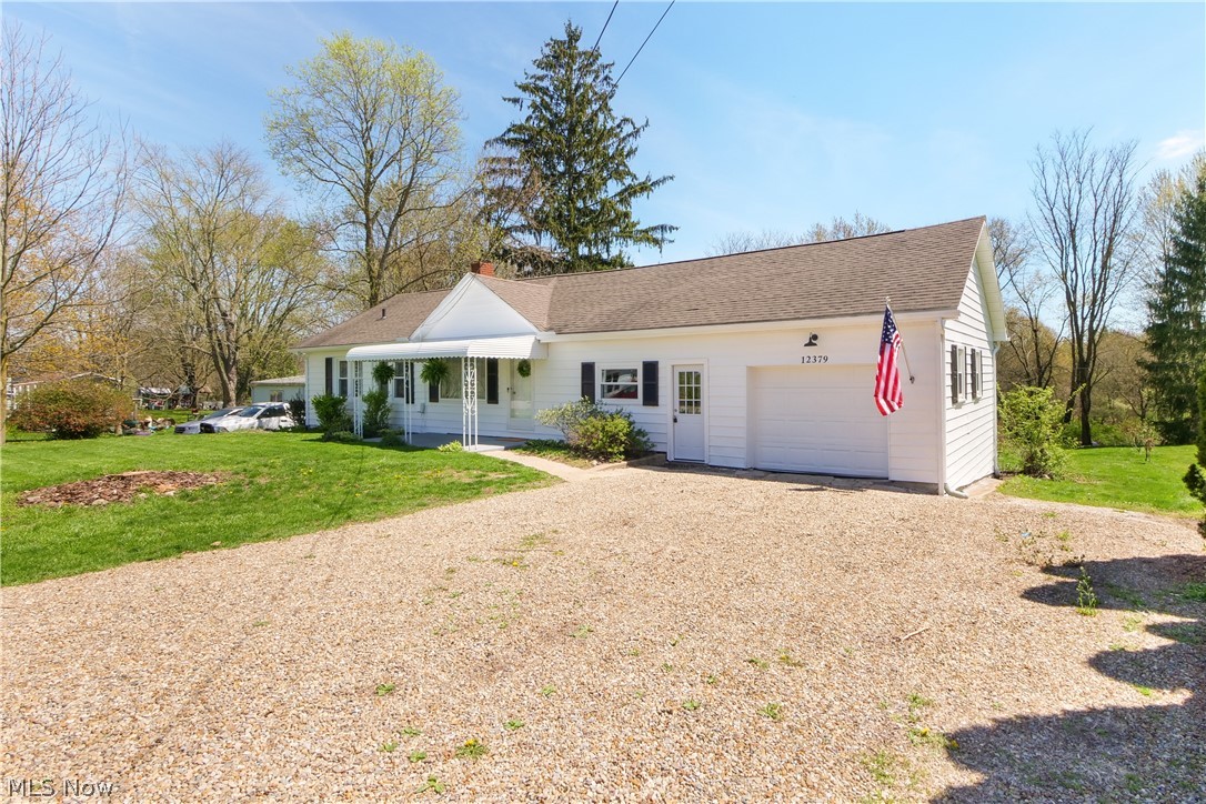 12379 Portage Street Rittman, OH 44270 - Photo 43 of 44 Ranch-style home with a front yard and a garage