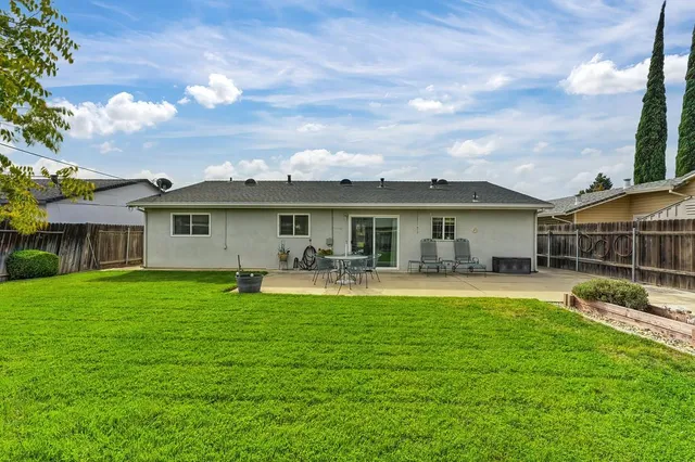 a front view of a house with garden and porch