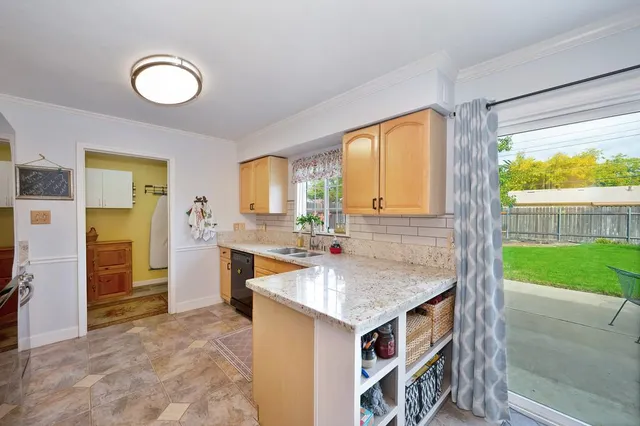 a kitchen that has a sink and a oven
