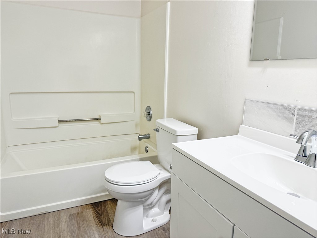 247 Reed Avenue Campbell, OH 44405 - Photo 22 of 41 Full bath with tub / shower combination, light wood finished floors, and vanity