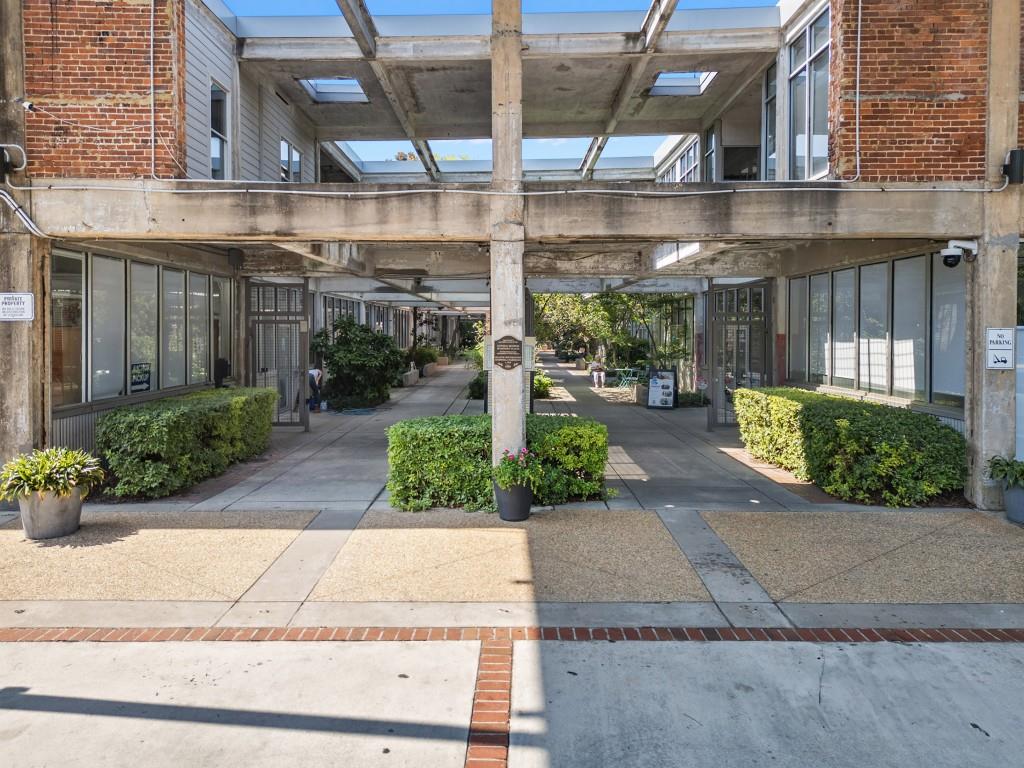659 Auburn Avenue Northeast, Unit 120 Atlanta, GA 30312 - Photo 3 of 22 a front view of a building with garden