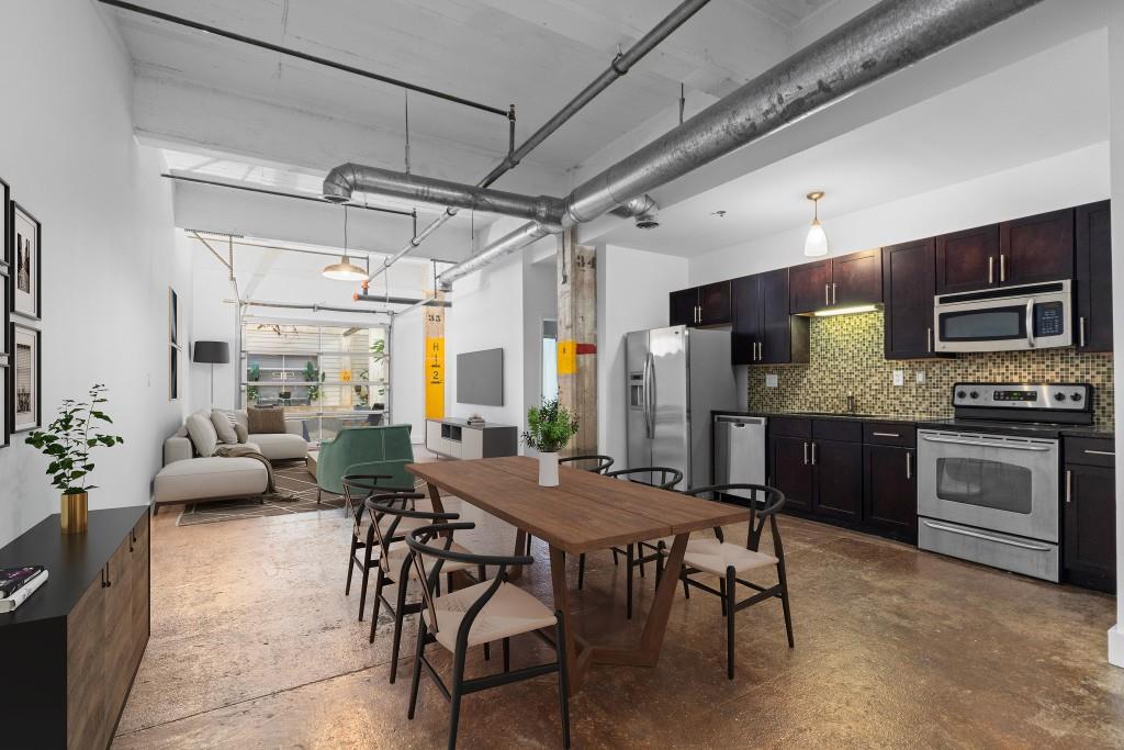 659 Auburn Avenue Northeast, Unit 120 Atlanta, GA 30312 - Photo 7 of 22 a view of a kitchen with furniture and a kitchen