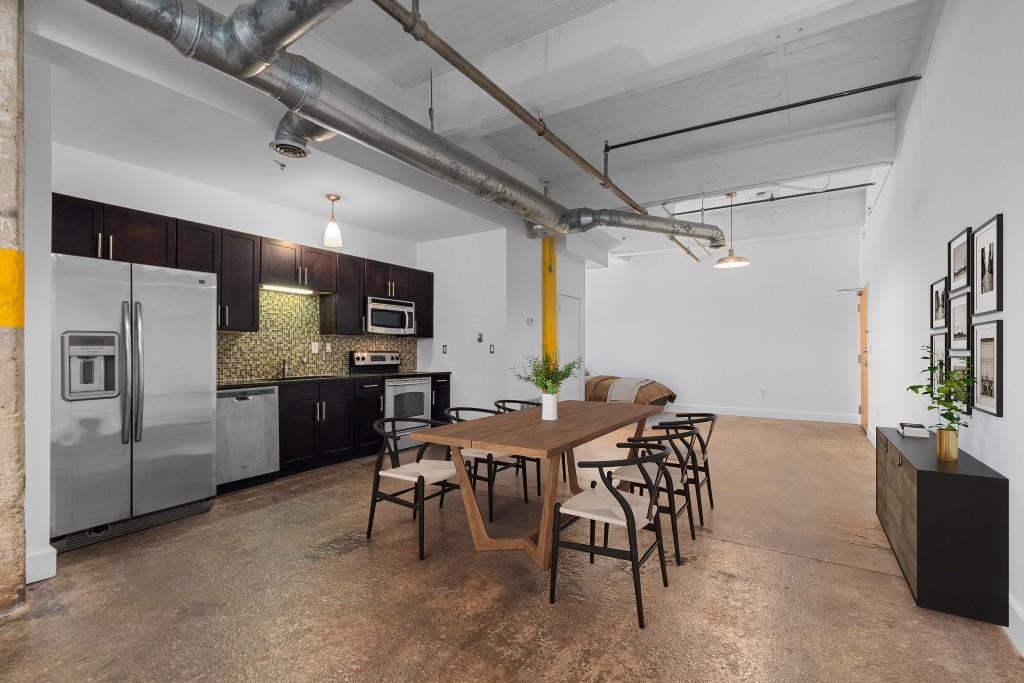 659 Auburn Avenue Northeast, Unit 120 Atlanta, GA 30312 - Photo 9 of 22 a view of a dining room with furniture