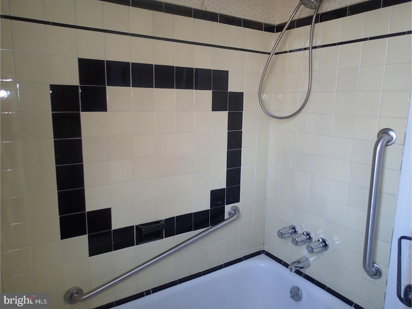 249 Fairview Road Springfield, PA 19064 - Photo 14 of 16 a bathroom with a shower and a mirror