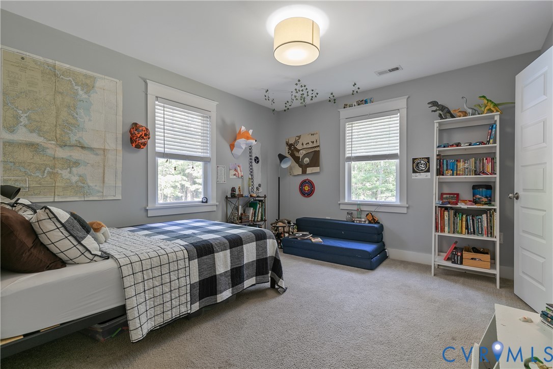 9749 Hoke Brady Road Henrico, VA 23231 - Photo 34 of 53 a bedroom with bed and a window