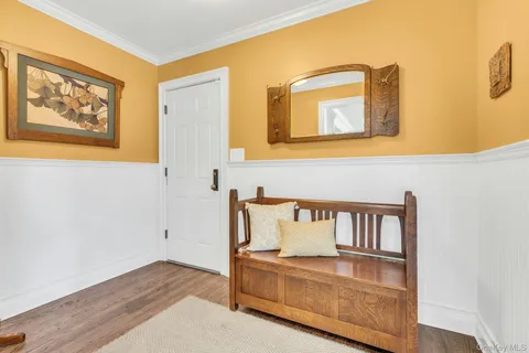 a view of front door with wooden floor