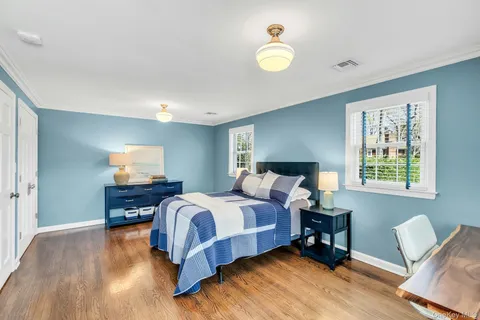 a bed room with a bed furniture and a window