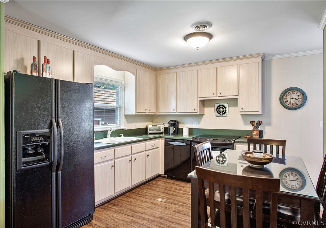 2104 Broad St Road Maidens, VA 23102 - Photo 11 of 29 a kitchen with stainless steel appliances granite countertop a stove a refrigerator a sink dishwasher and white cabinets with wooden floor