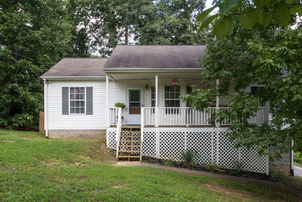 201 Gaskins Road Dickson, TN 37055 - Photo 1 of 24 a front view of a house with a garden