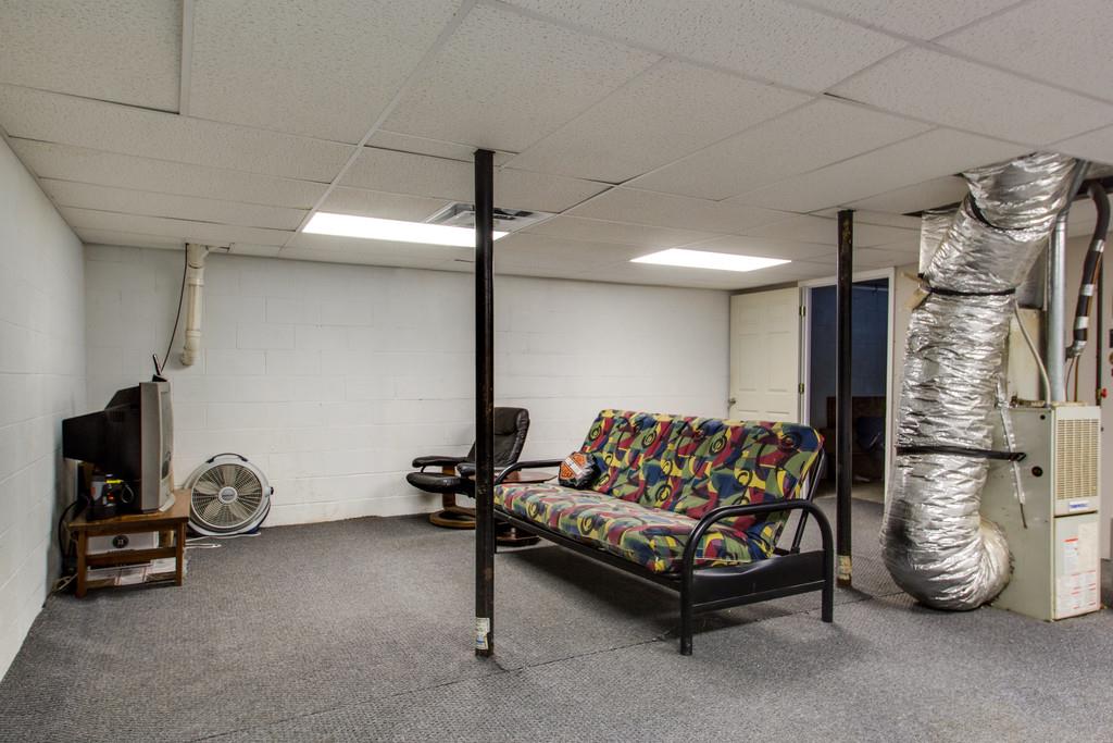 201 Gaskins Road Dickson, TN 37055 - Photo 17 of 24 a living room with furniture gym equipment and a rug
