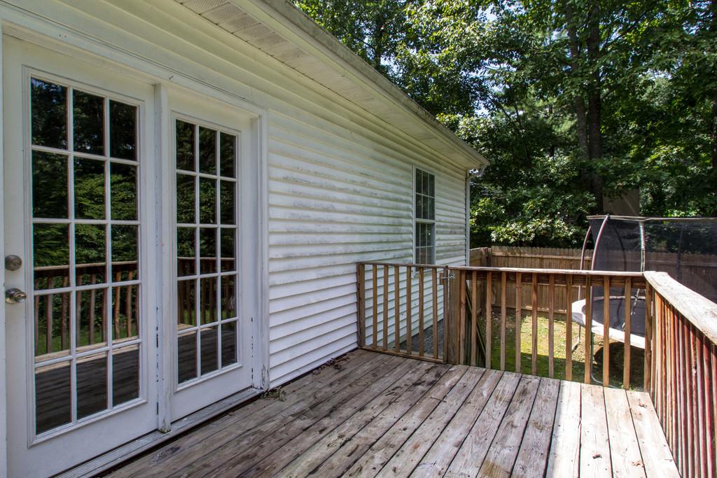 201 Gaskins Road Dickson, TN 37055 - Photo 20 of 24 a view of deck with a large window and wooden floor