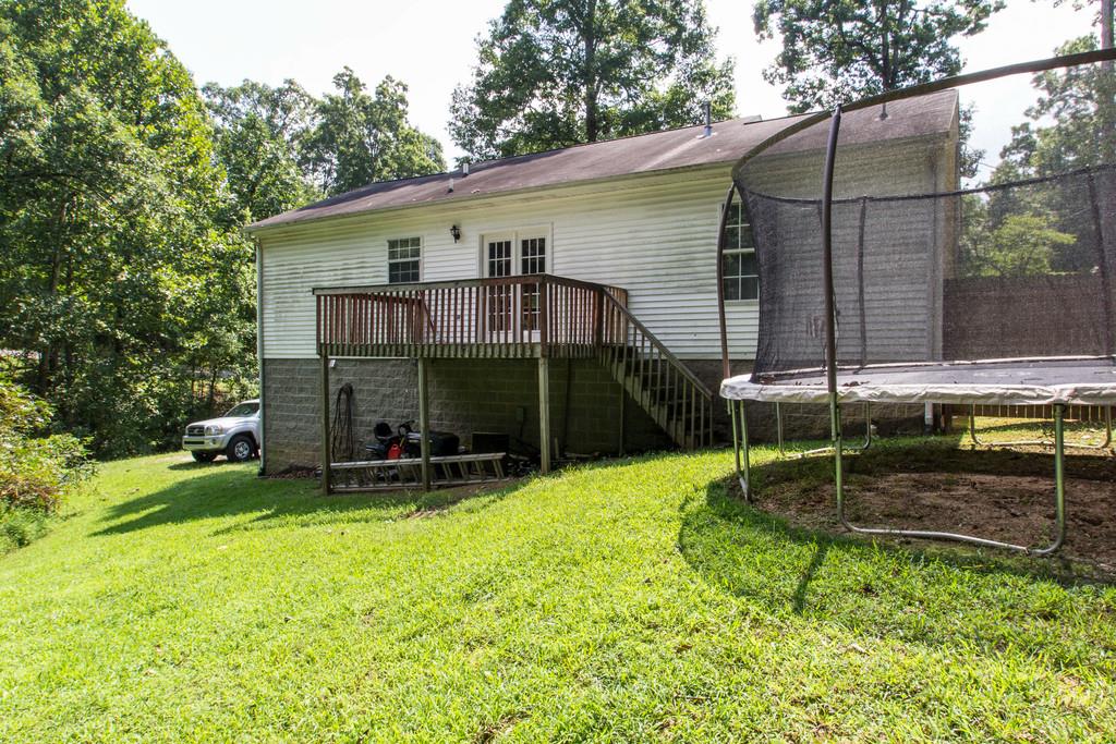 201 Gaskins Road Dickson, TN 37055 - Photo 22 of 24 a view of a chair and table in backyard of the house