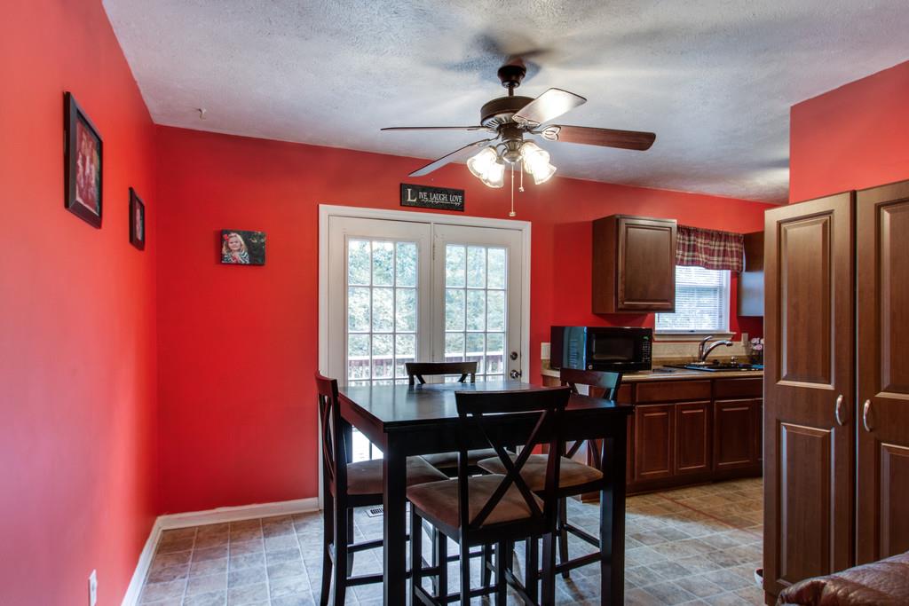 201 Gaskins Road Dickson, TN 37055 - Photo 6 of 24 a view of a dining room with furniture window and wooden floor