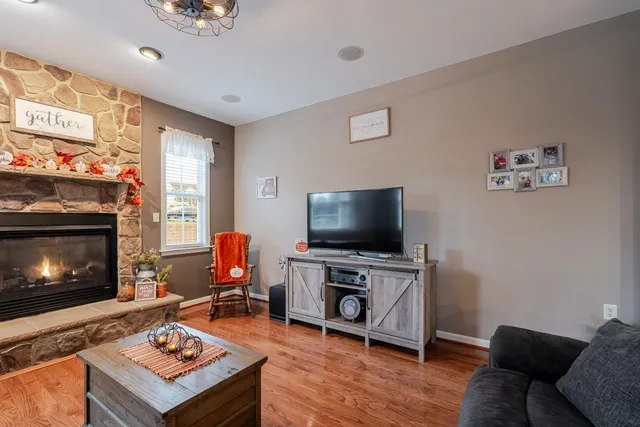 a bedroom with a bed and a flat tv screen