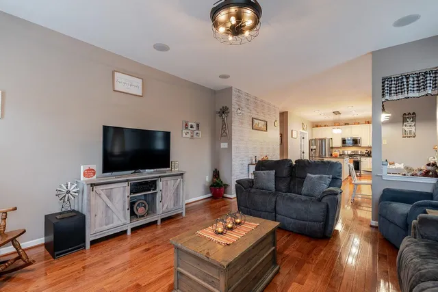 a bed room with a bed and a chandelier