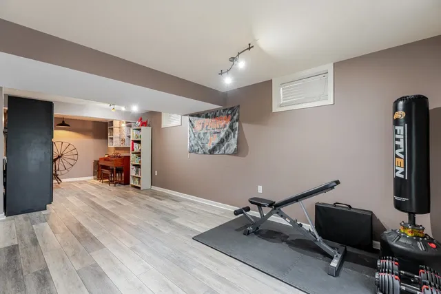 an aerial view of residential houses with outdoor space and swimming pool