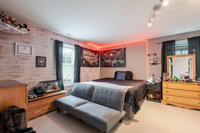 an aerial view of residential houses with yard