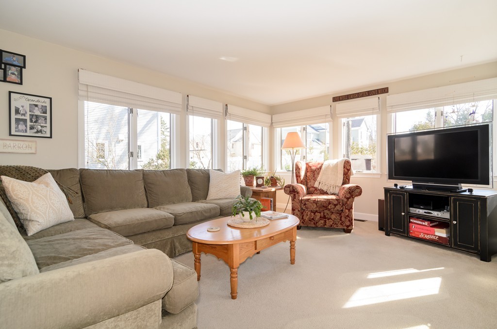 22 MacArthur Road Wellesley, MA 02482 - Photo 5 of 15 a living room with furniture and a flat screen tv