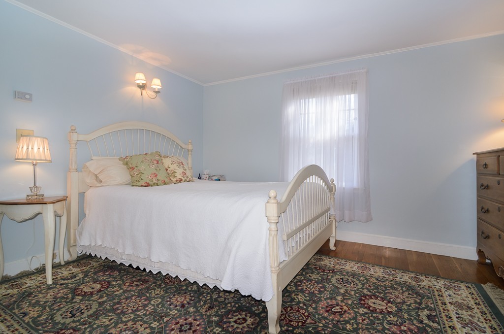 22 MacArthur Road Wellesley, MA 02482 - Photo 9 of 15 a bedroom with a bed and a window