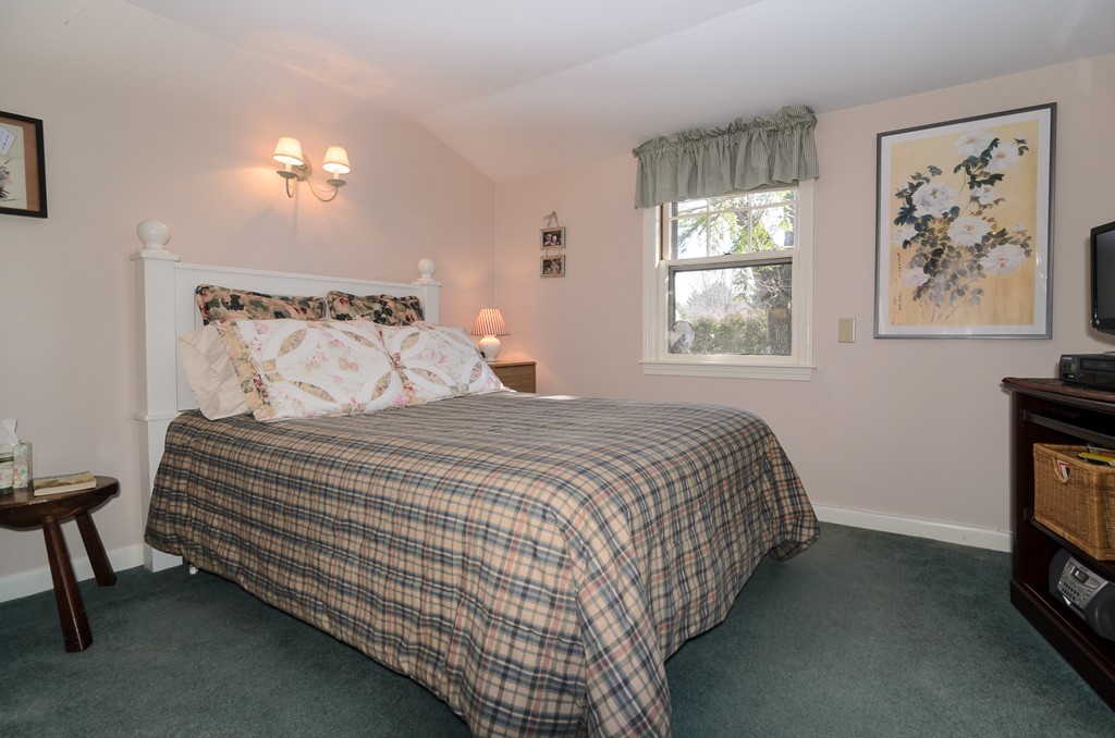 22 MacArthur Road Wellesley, MA 02482 - Photo 10 of 15 a bedroom with a bed and a window