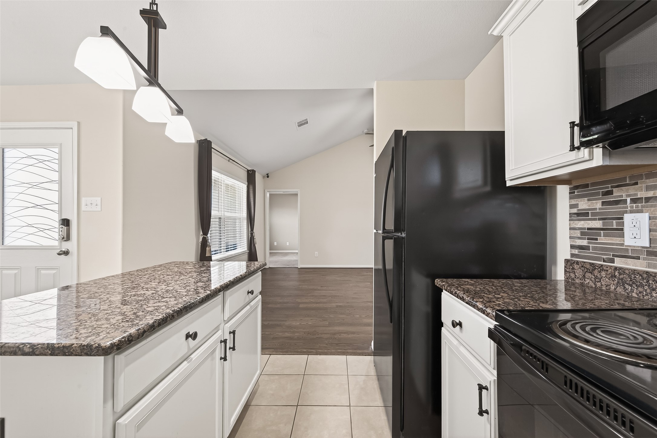 2319 Seabourne Trails Road Rosenberg, TX 77469 - Photo 15 of 36 a kitchen with granite countertop a refrigerator and a sink