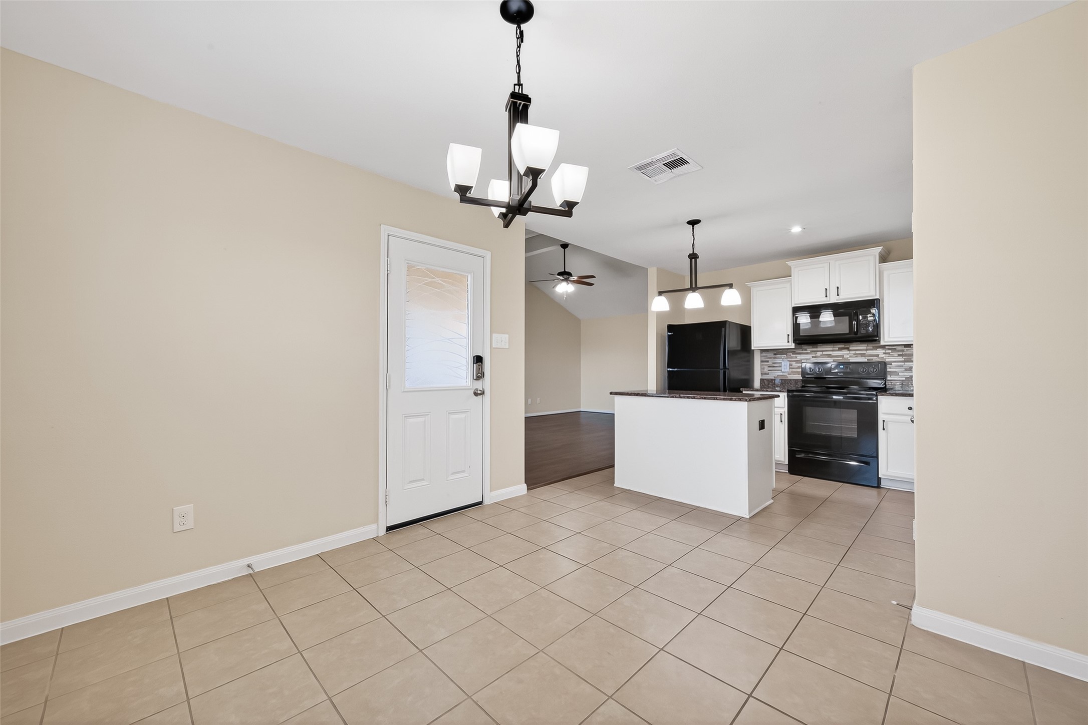 2319 Seabourne Trails Road Rosenberg, TX 77469 - Photo 18 of 36 a view of kitchen with stainless steel appliances granite countertop white cabinets and refrigerator