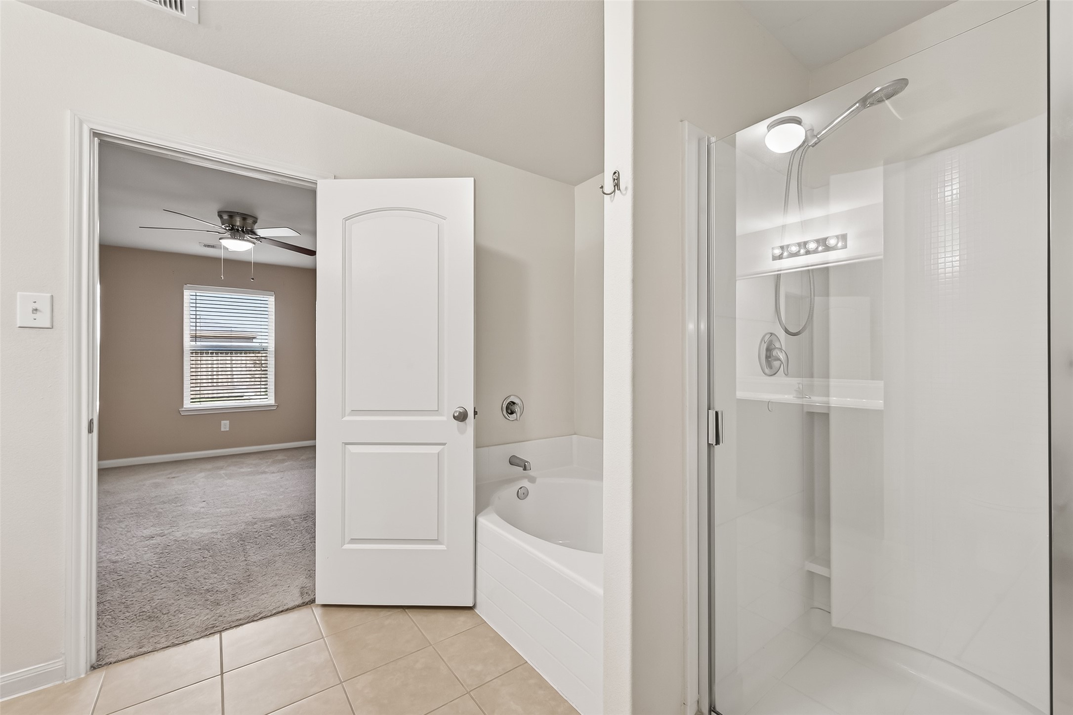 2319 Seabourne Trails Road Rosenberg, TX 77469 - Photo 22 of 36 a bathroom with a bathtub shower and a sink