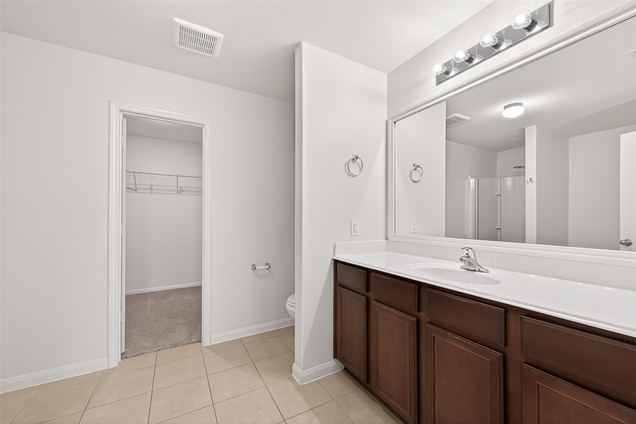 2319 Seabourne Trails Road Rosenberg, TX 77469 - Photo 23 of 36 a spacious bathroom with a double vanity sink a mirror and a