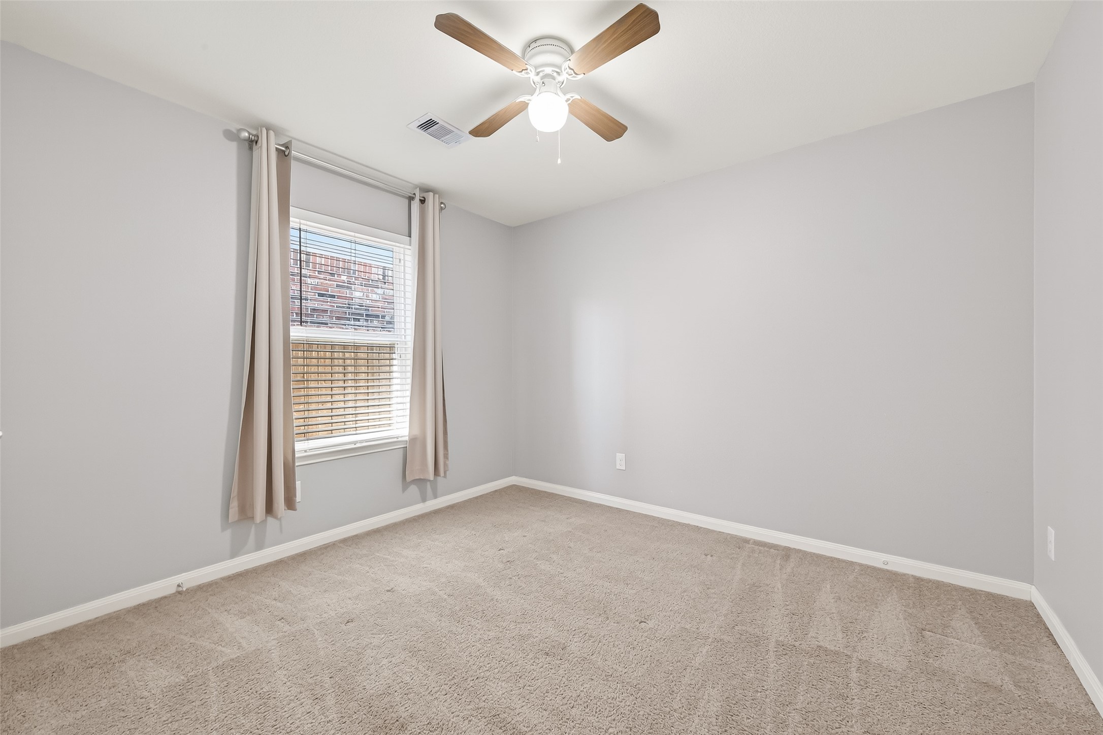 2319 Seabourne Trails Road Rosenberg, TX 77469 - Photo 27 of 36 an empty room with windows and fan