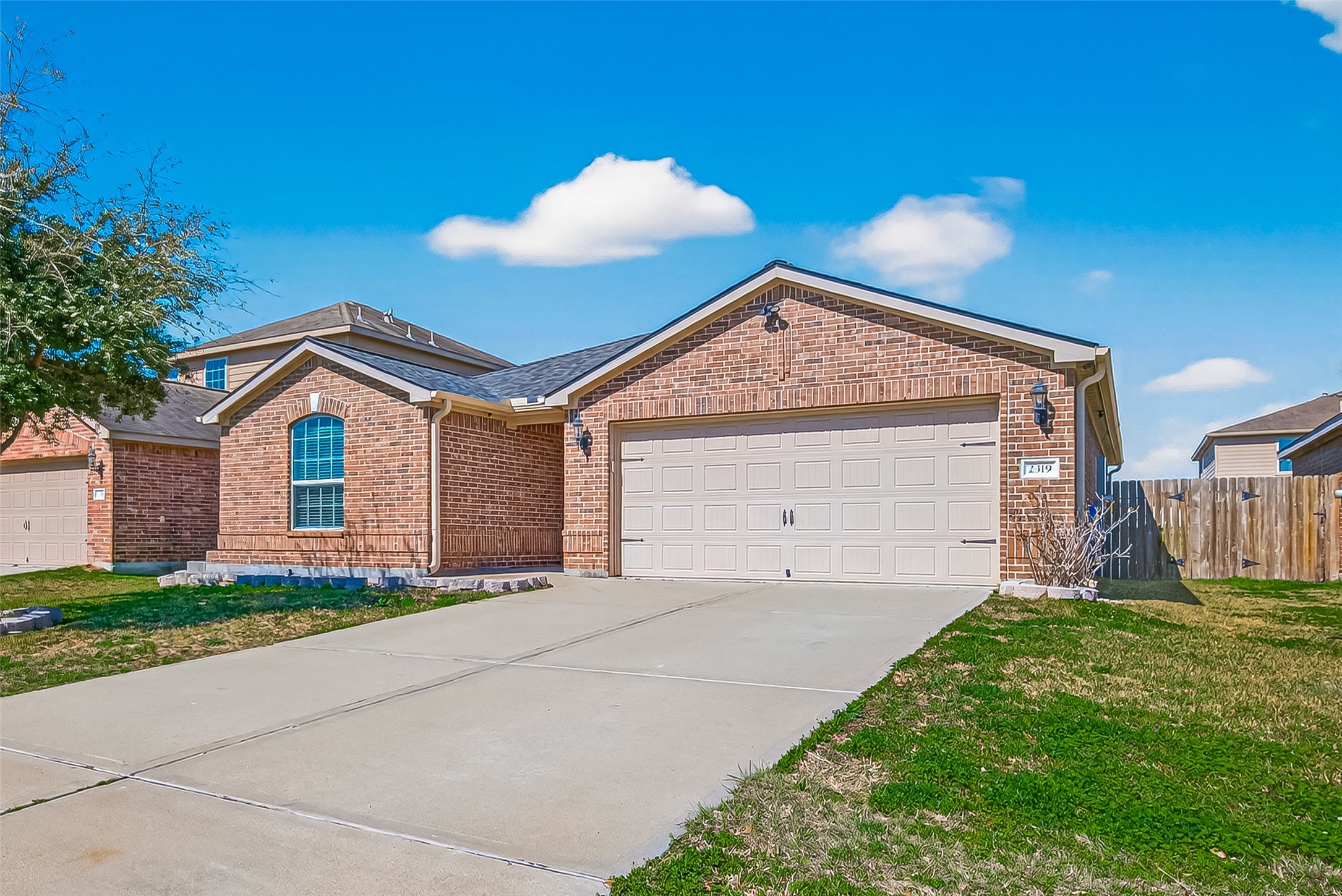 2319 Seabourne Trails Road Rosenberg, TX 77469 - Photo 3 of 36 a view of a house with a yard and garage