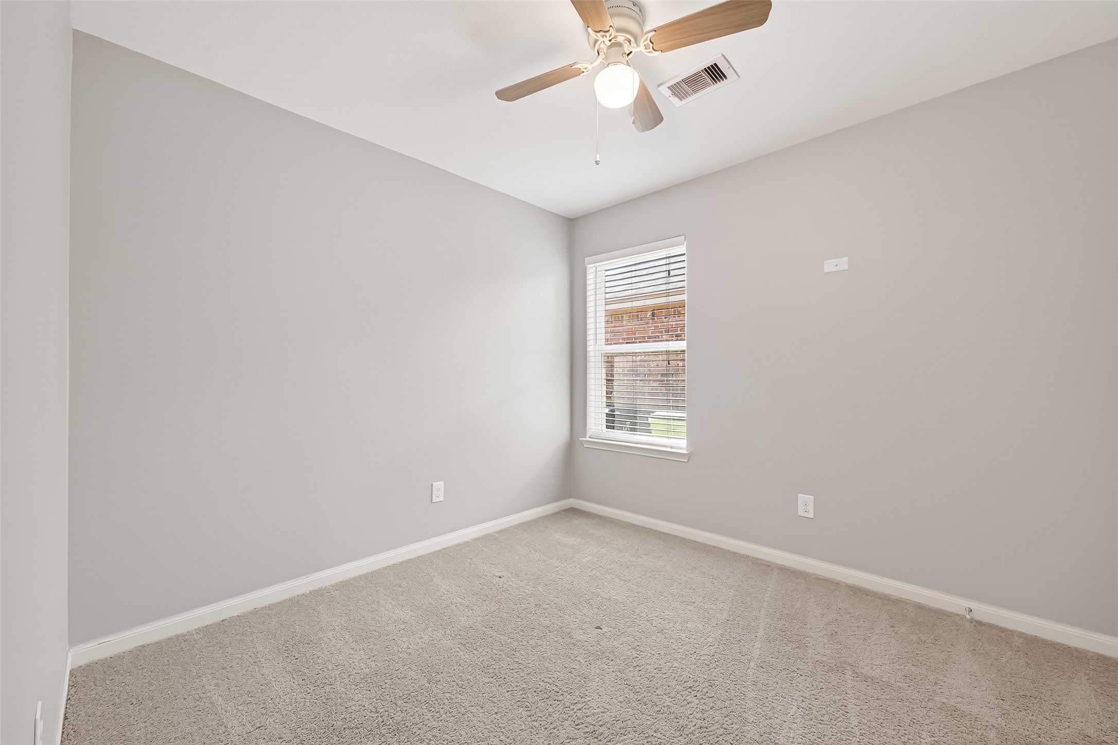 2319 Seabourne Trails Road Rosenberg, TX 77469 - Photo 32 of 36 an empty room with a window and a fan
