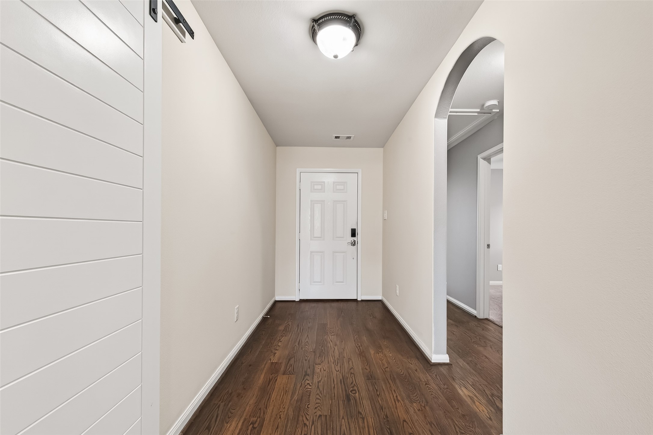2319 Seabourne Trails Road Rosenberg, TX 77469 - Photo 5 of 36 a view of a hallway with wooden floor