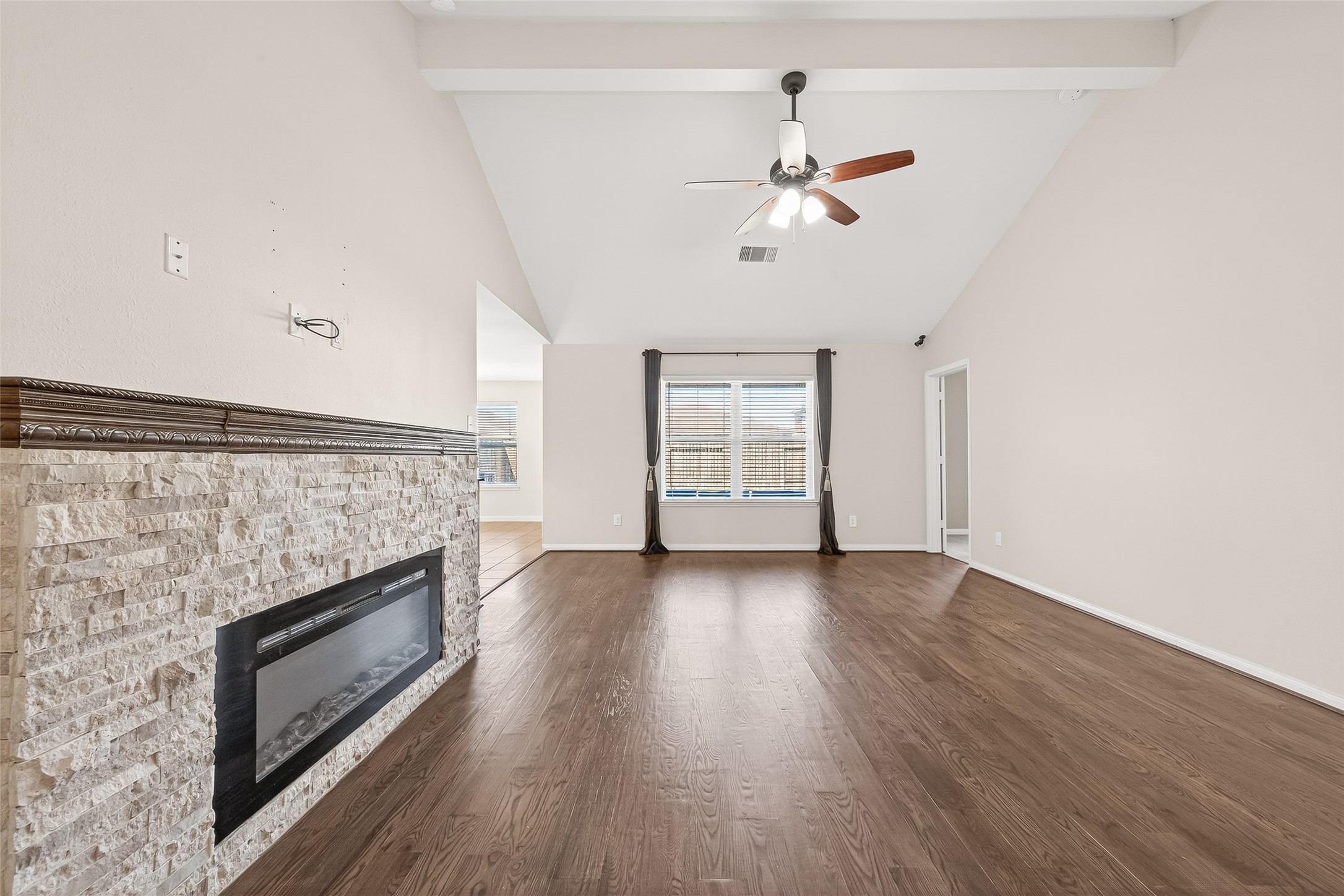2319 Seabourne Trails Road Rosenberg, TX 77469 - Photo 7 of 36 a view of empty room with wooden floor and fireplace