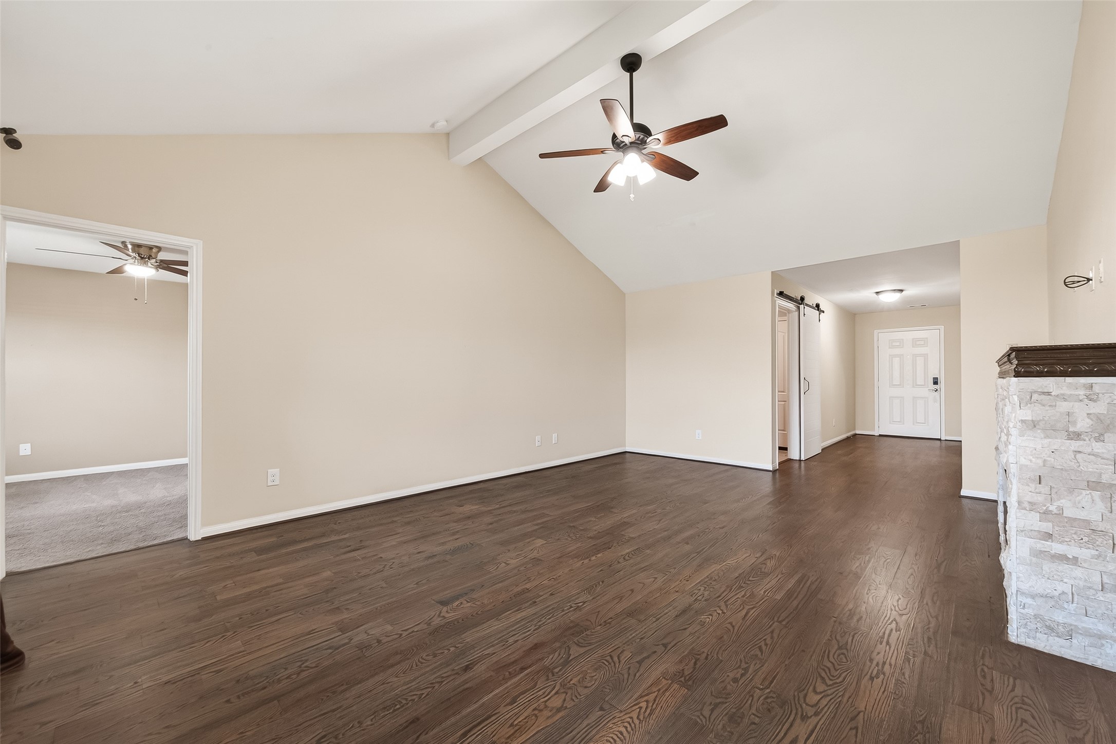 2319 Seabourne Trails Road Rosenberg, TX 77469 - Photo 10 of 36 a view of an empty room with wooden floor and a ceiling fan