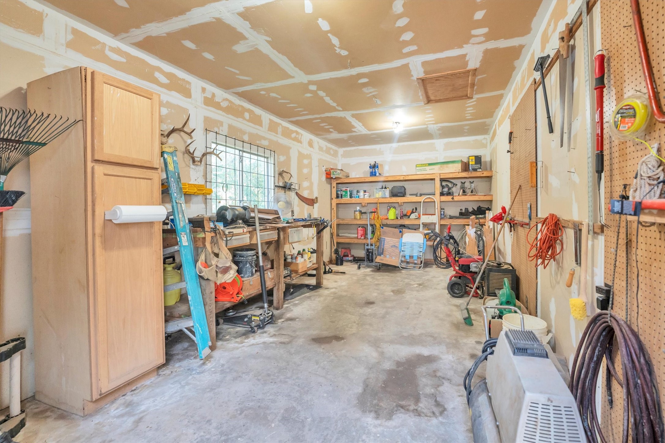 3197 Mann Road Conroe, TX 77303 - Photo 17 of 48 a view of storage and utility room