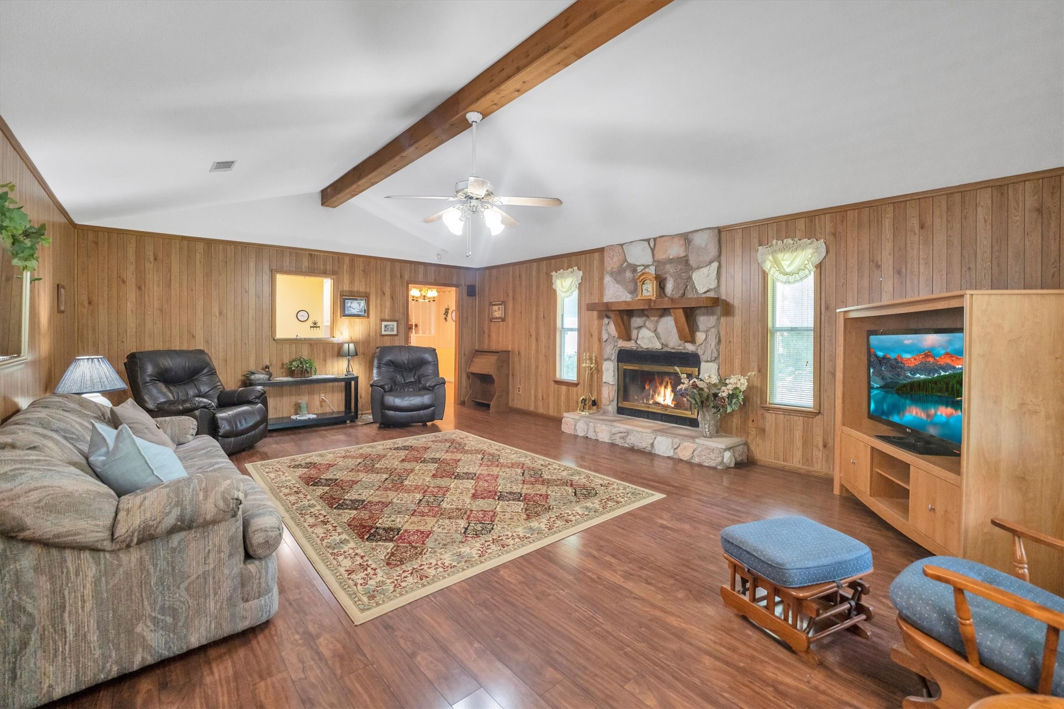 3197 Mann Road Conroe, TX 77303 - Photo 19 of 48 a living room with furniture and a flat screen tv