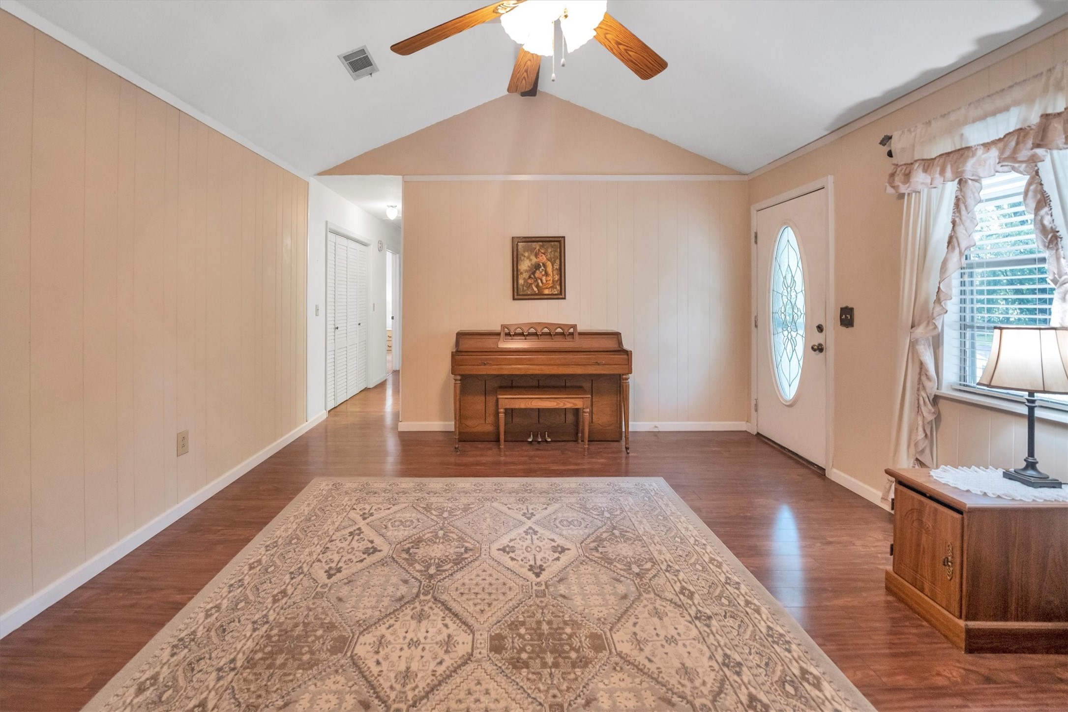 3197 Mann Road Conroe, TX 77303 - Photo 31 of 48 a spacious bedroom with a bed and a dresser with wooden floor