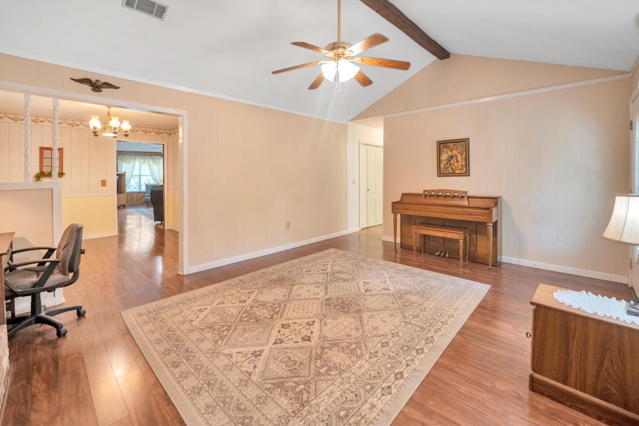 3197 Mann Road Conroe, TX 77303 - Photo 32 of 48 a living room with furniture and a wooden floor