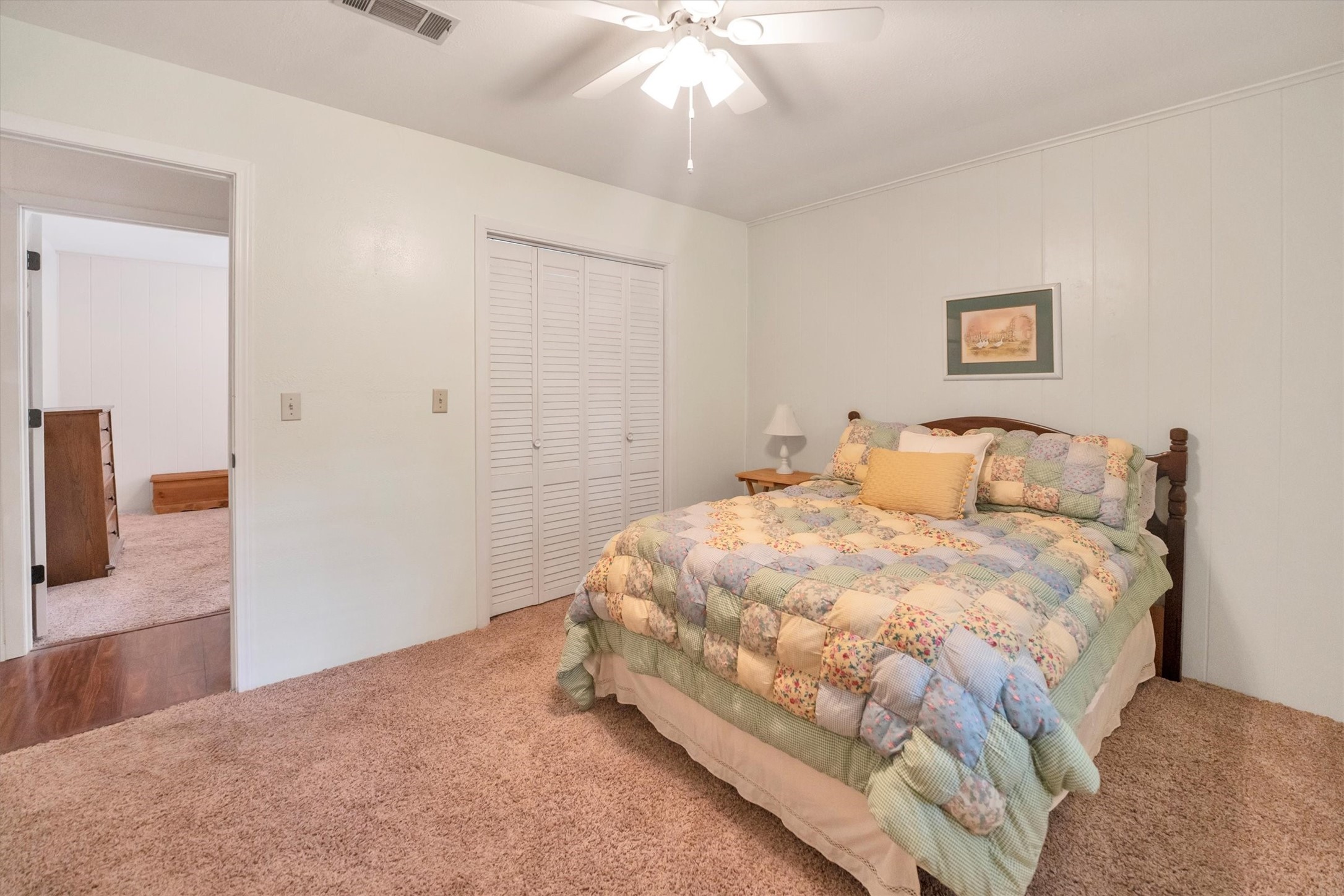 3197 Mann Road Conroe, TX 77303 - Photo 38 of 48 a bedroom with a bed and a chandelier