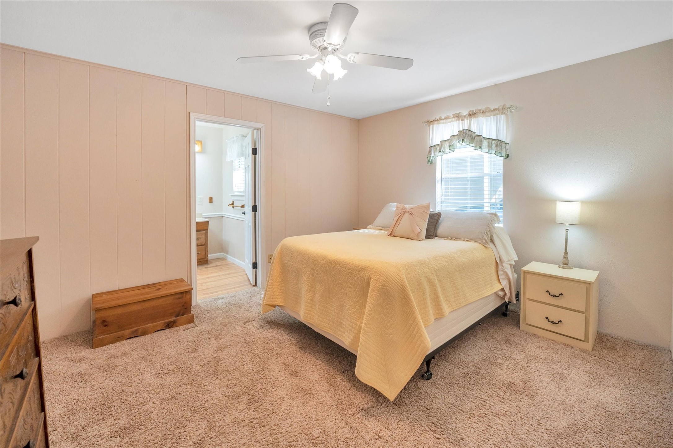 3197 Mann Road Conroe, TX 77303 - Photo 39 of 48 a bedroom with a bed and a chandelier