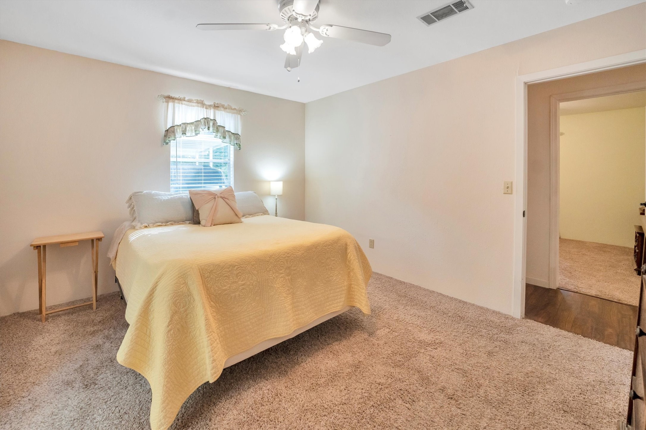 3197 Mann Road Conroe, TX 77303 - Photo 40 of 48 a bedroom with a bed and a chandelier