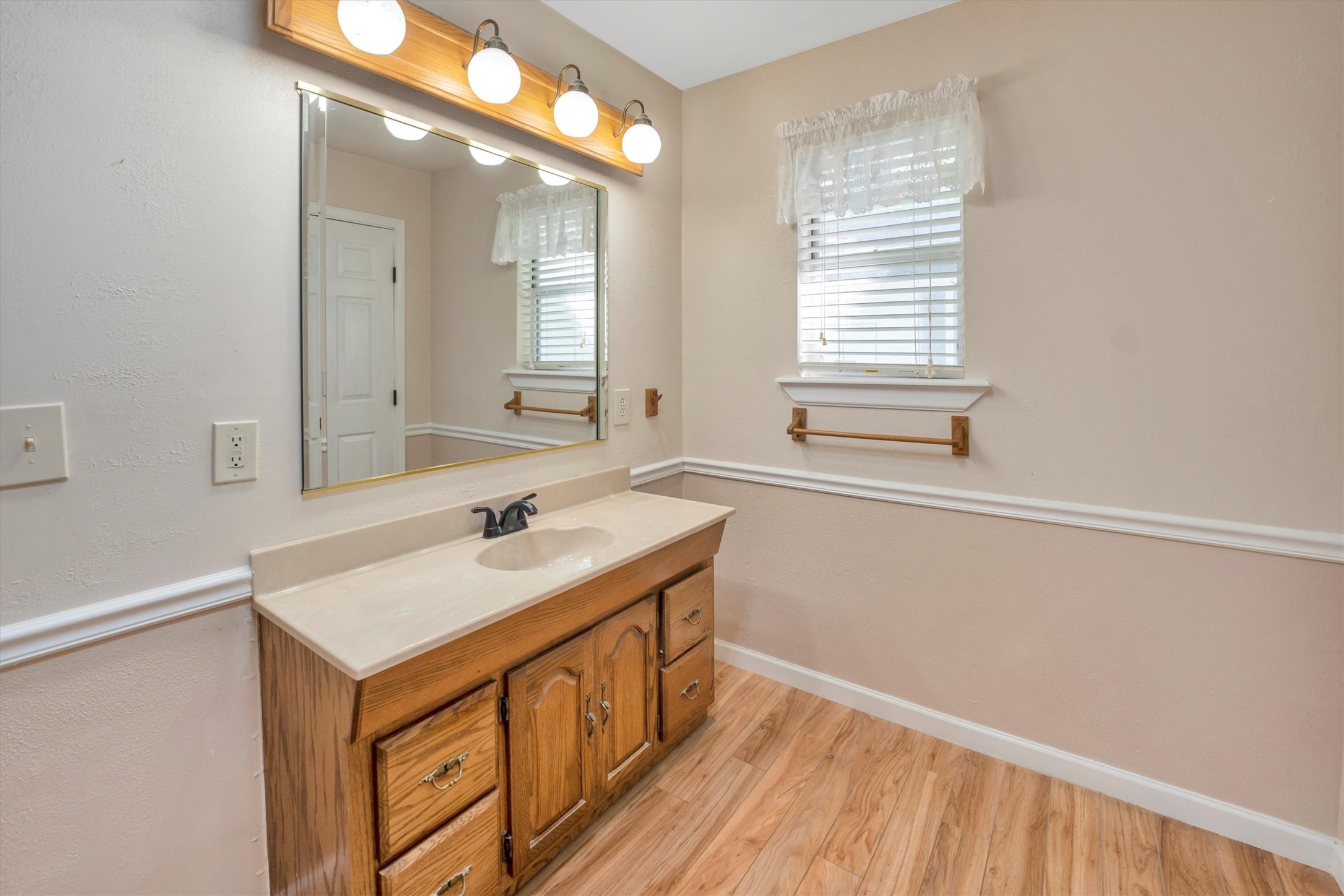 3197 Mann Road Conroe, TX 77303 - Photo 42 of 48 a bathroom with a sink and a mirror