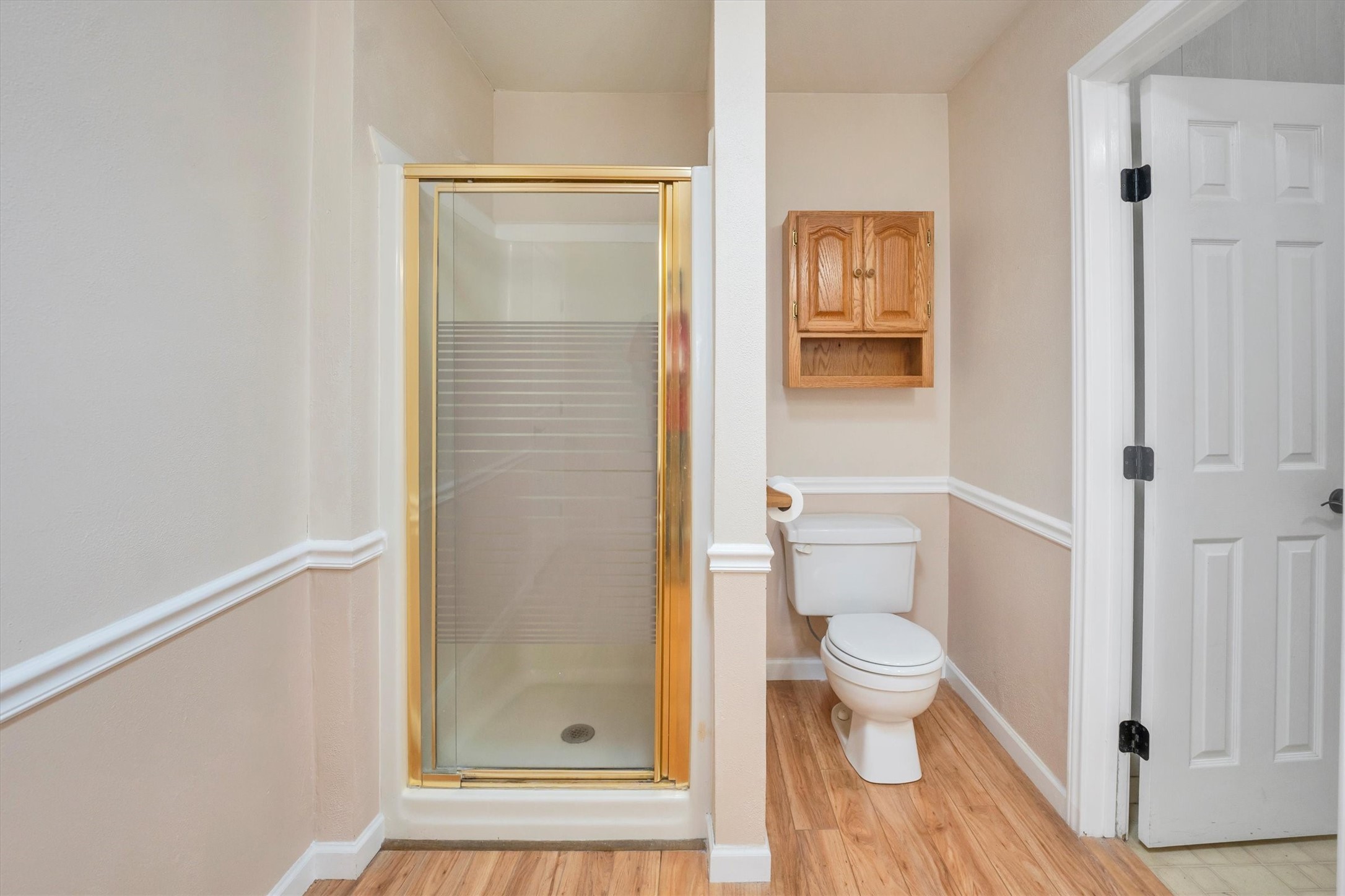 3197 Mann Road Conroe, TX 77303 - Photo 43 of 48 a bathroom with a toilet and a shower