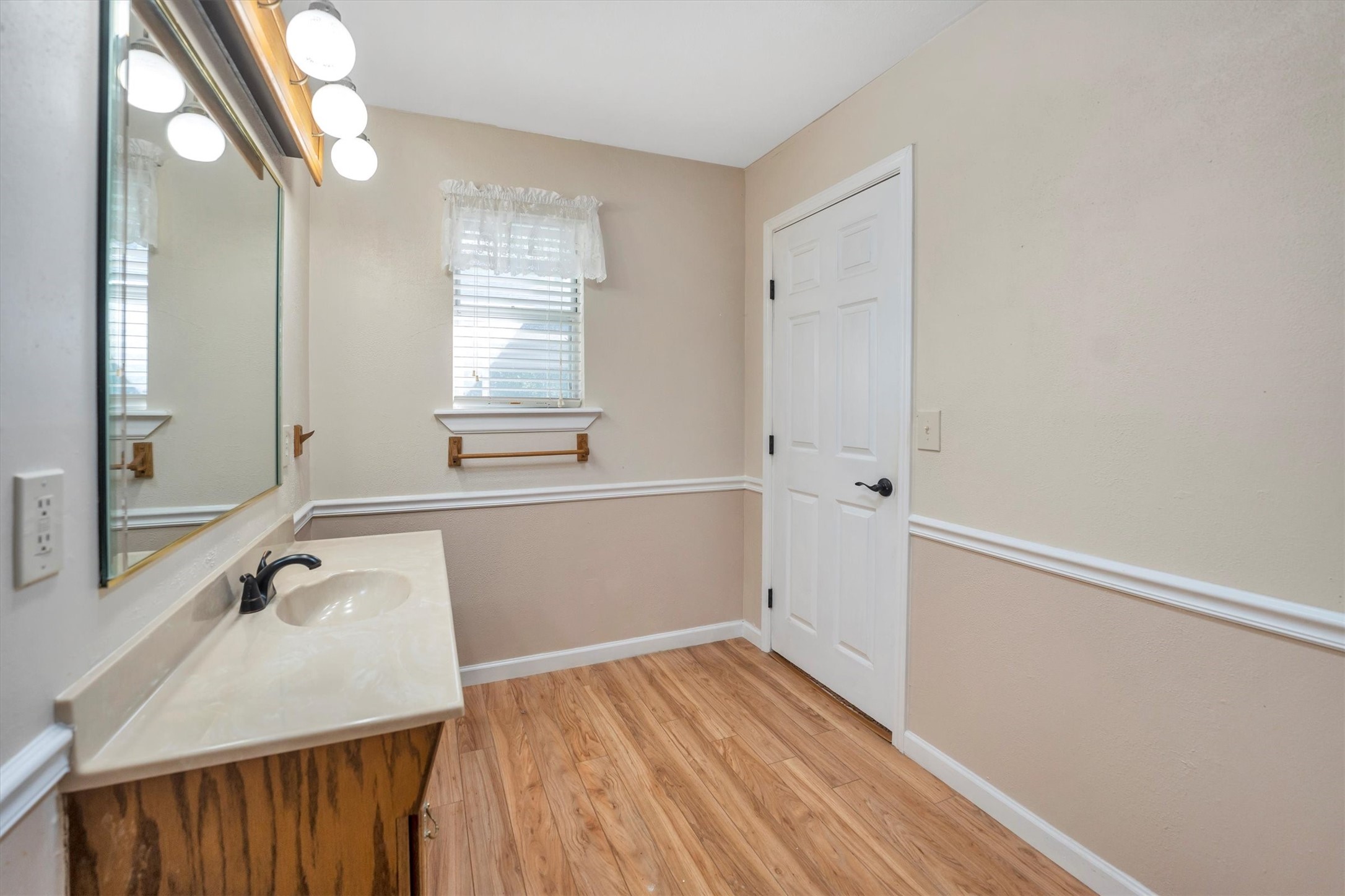 3197 Mann Road Conroe, TX 77303 - Photo 44 of 48 a bathroom with a sink and a mirror