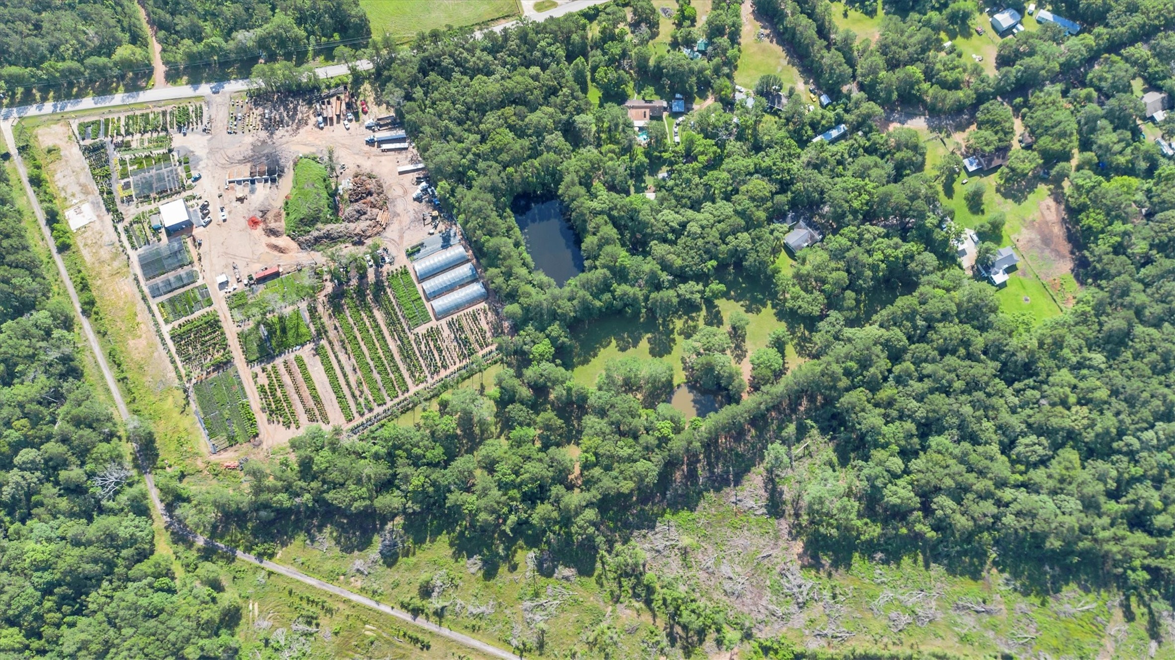 3197 Mann Road Conroe, TX 77303 - Photo 47 of 48 an aerial view of residential house with outdoor space and trees all around