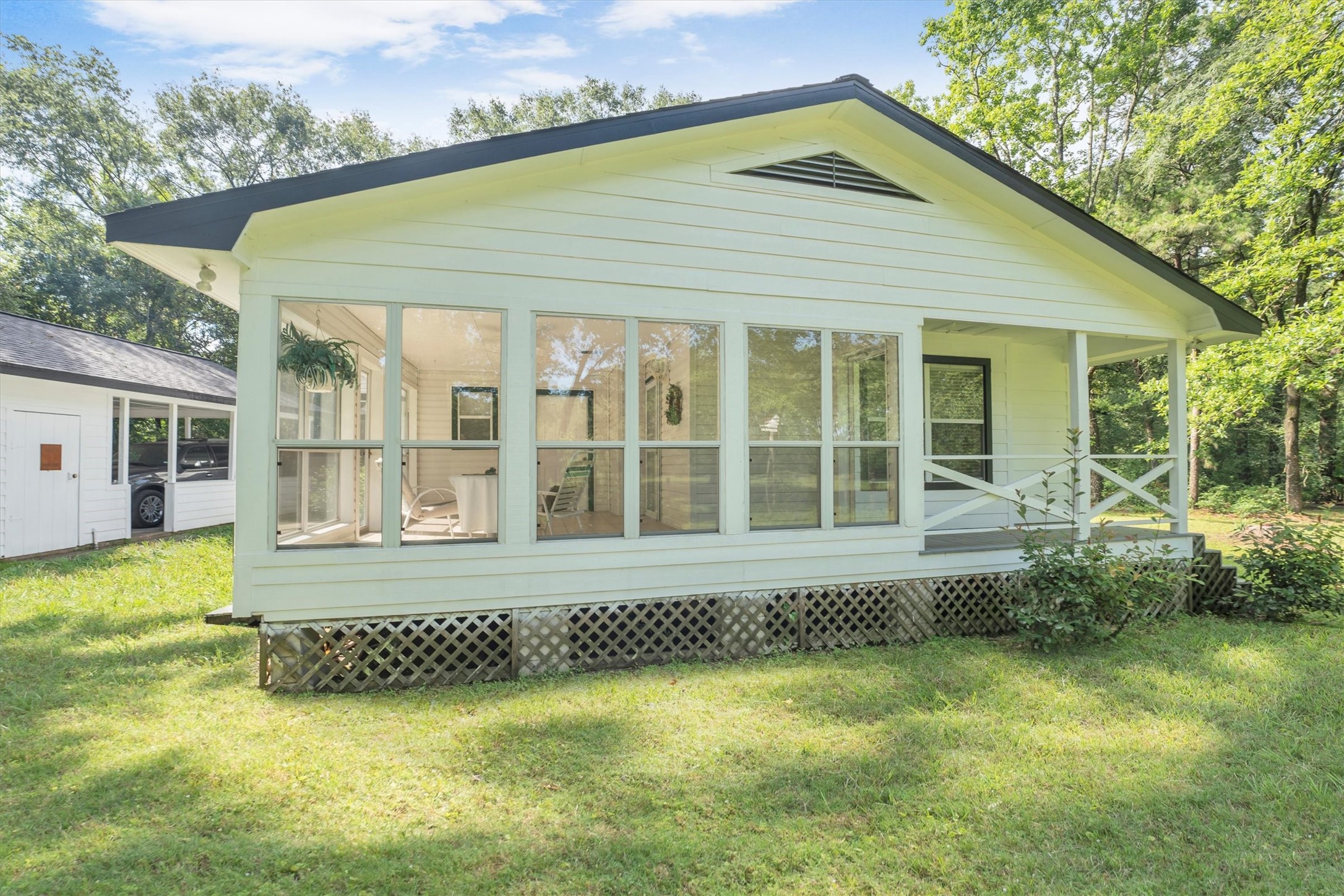 3197 Mann Road Conroe, TX 77303 - Photo 8 of 48 a front view of a house with a garden