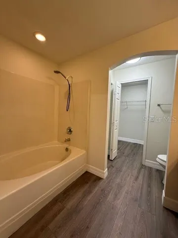a bathroom with a bathtub and a shower